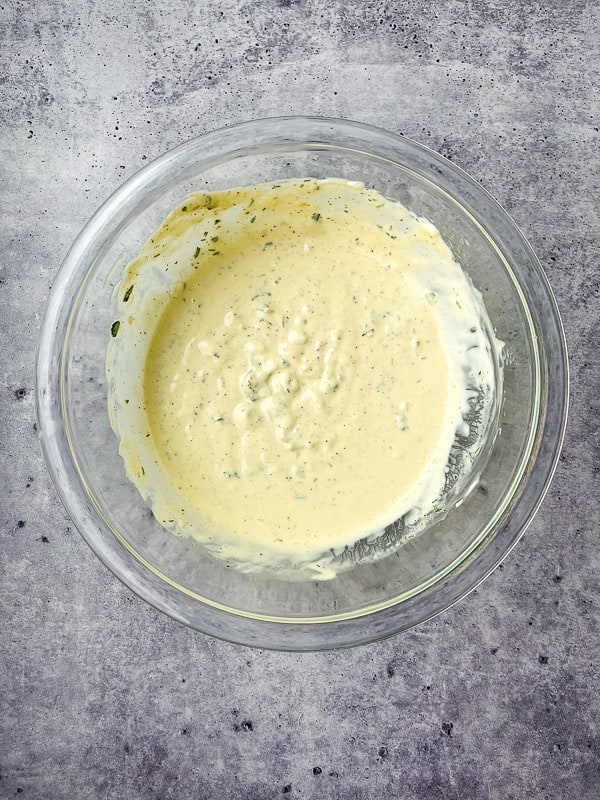 Creamy tartar sauce in a clear bowl